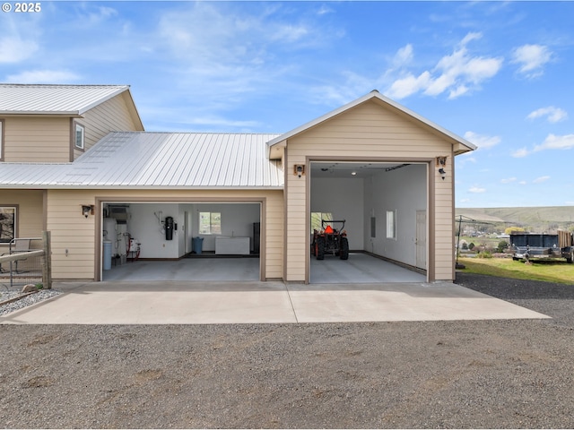 garage with gravel driveway