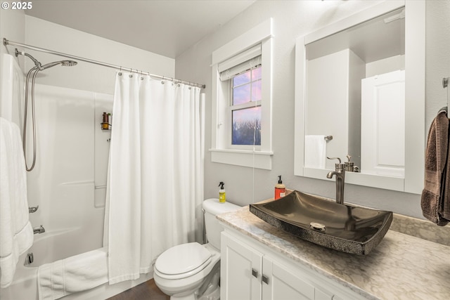 full bathroom with vanity, toilet, and shower / bath combo with shower curtain