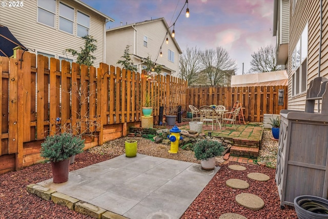 view of patio terrace at dusk