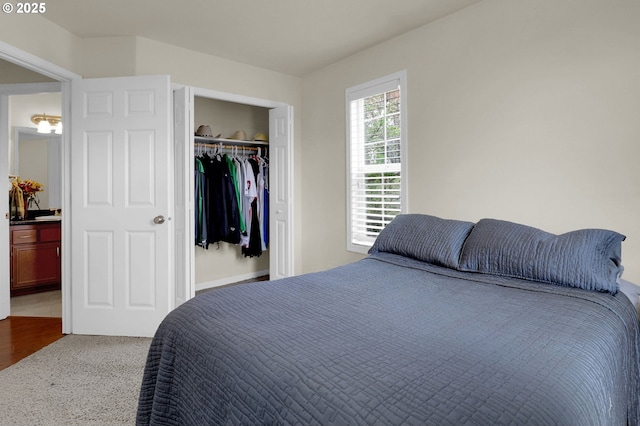 bedroom with carpet flooring and a closet