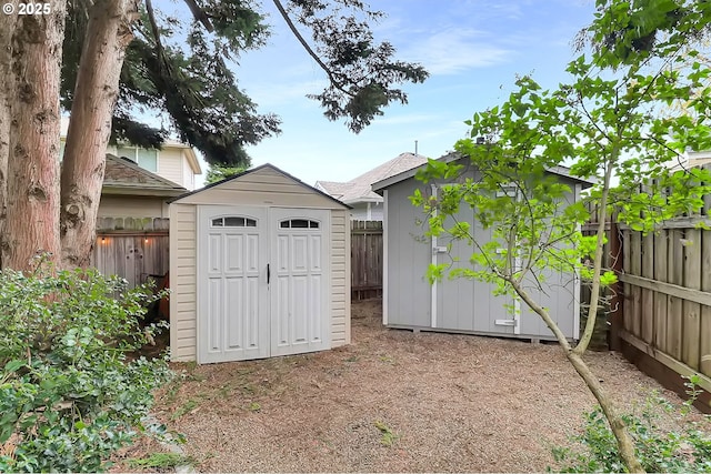 view of shed with a fenced backyard