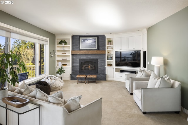 carpeted living room with a large fireplace