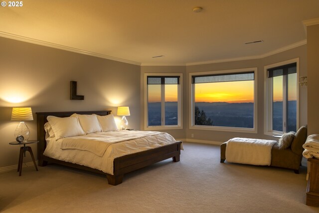 carpeted bedroom featuring crown molding