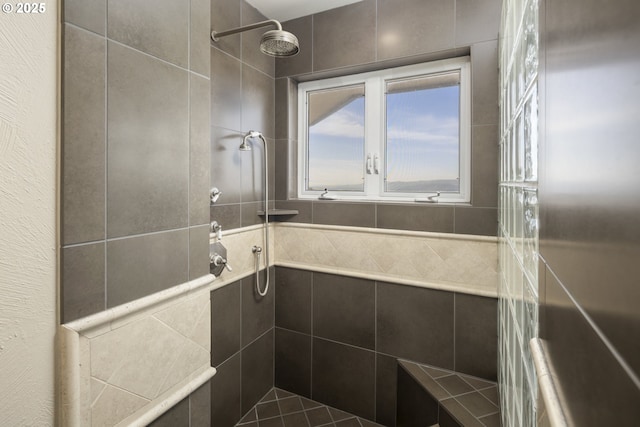 bathroom with tiled shower