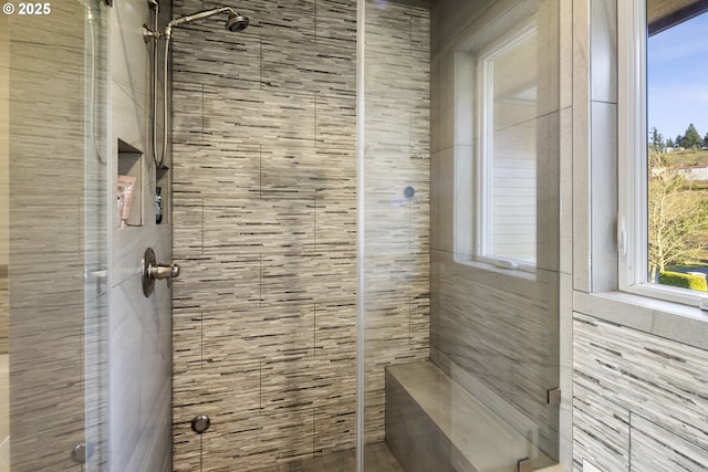 bathroom with tiled shower