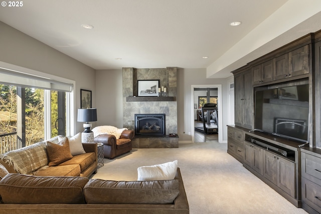 carpeted living room with a fireplace