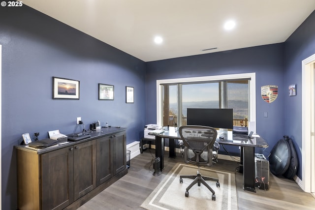 office area with wood-type flooring