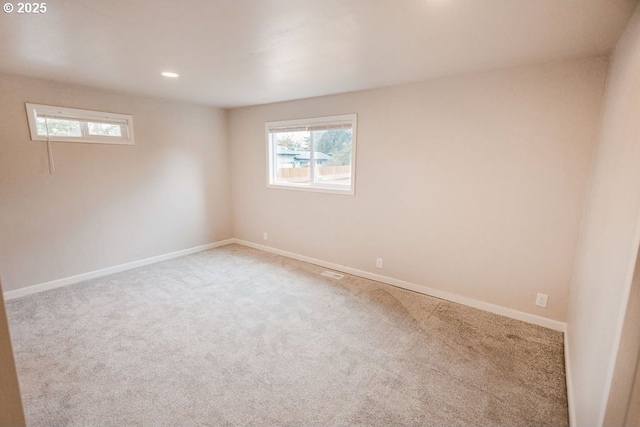2797 Tulip St, Eugene, OR 97408 - carpeted empty room with baseboards and recessed lighting