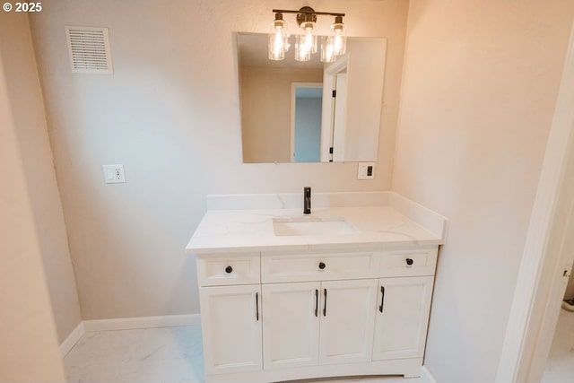2797 Tulip St, Eugene, OR 97408 - bathroom featuring vanity, marble finish floors, and baseboards