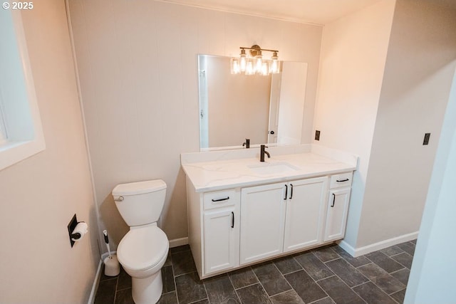 2797 Tulip St, Eugene, OR 97408 - bathroom featuring toilet, vanity, and baseboards