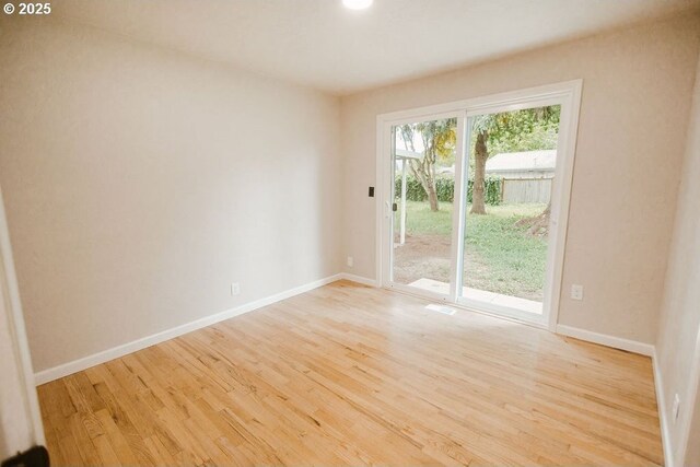 2797 Tulip St, Eugene, OR 97408 - unfurnished room with wood finished floors and baseboards