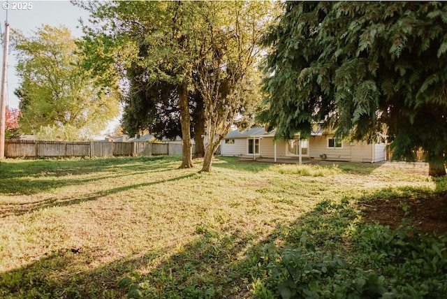 view of yard featuring fence