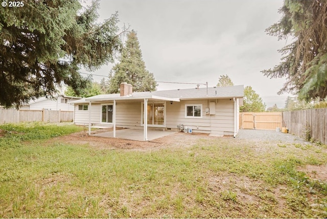2797 Tulip St, Eugene, OR 97408 - rear view of house with a patio area and a chimney