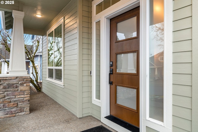 entrance to property featuring a porch