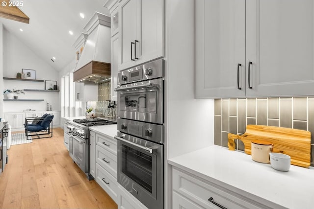 NE 43rd Cir Lot 1, Camas, WA 98607 - kitchen featuring stainless steel appliances, light wood-style flooring, premium range hood, light countertops, and backsplash