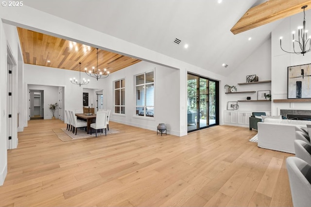 NE 43rd Cir Lot 1, Camas, WA 98607 - dining area with a chandelier, high vaulted ceiling, beamed ceiling, light wood-type flooring, and a fireplace