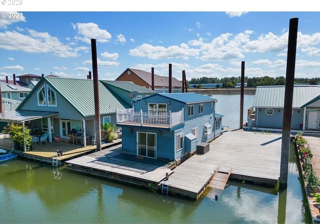 view of dock with a water view and a balcony