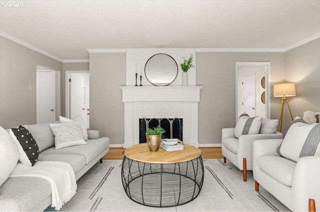 2425 SW 19th Ave Unit 9, Portland, OR 97201 - living room with crown molding, light wood-style floors, and a fireplace