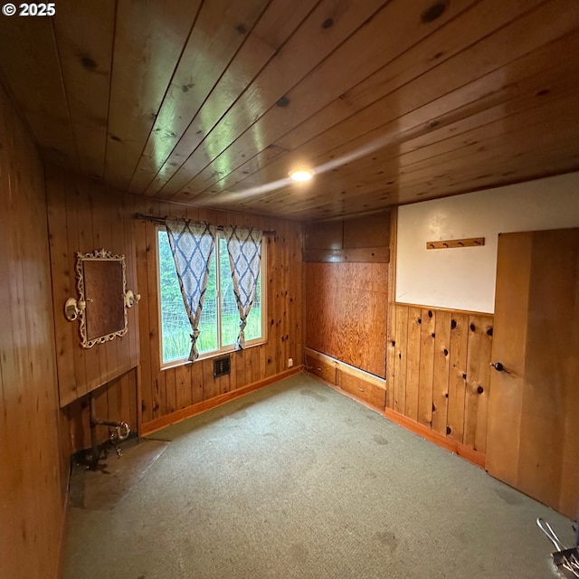 28500 Ruth Ln, Eugene, OR 97402 - basement with wooden ceiling, wood walls, carpet flooring, and baseboards