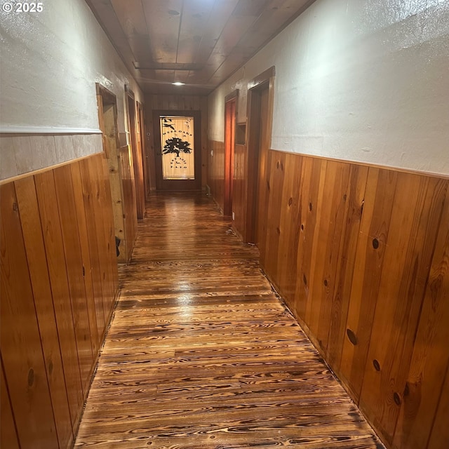 28500 Ruth Ln, Eugene, OR 97402 - hallway featuring hardwood / wood-style floors, wooden walls, and wainscoting