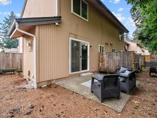 rear view of property featuring a patio area