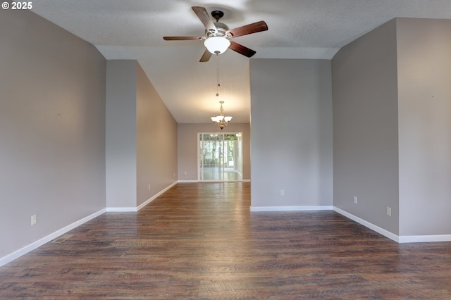 640 Sherman Dr, The Dalles, OR 97058 - empty room with ceiling fan, a chandelier, dark wood-style flooring, baseboards, and vaulted ceiling