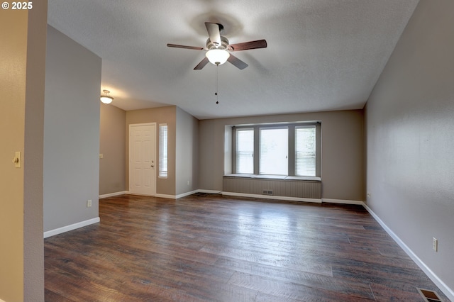 640 Sherman Dr, The Dalles, OR 97058 - spare room with ceiling fan, dark wood-style floors, baseboards, and a textured ceiling
