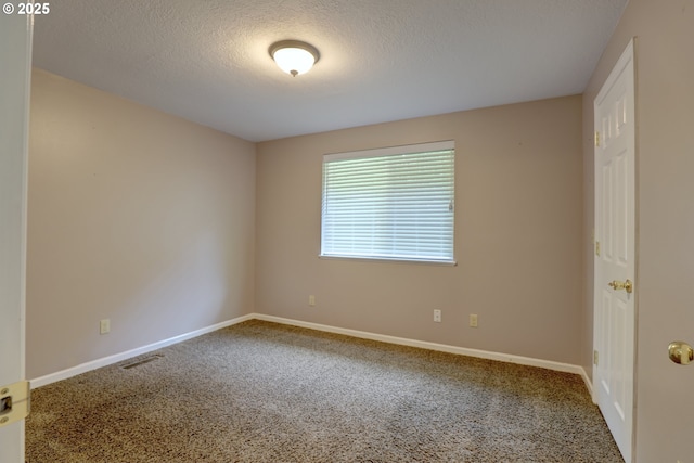 640 Sherman Dr, The Dalles, OR 97058 - carpeted spare room with a textured ceiling and baseboards