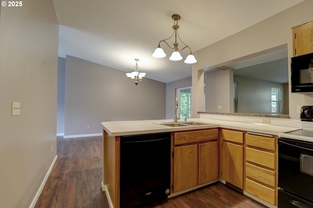 640 Sherman Dr, The Dalles, OR 97058 - kitchen featuring black appliances, a sink, light countertops, and dark wood-type flooring