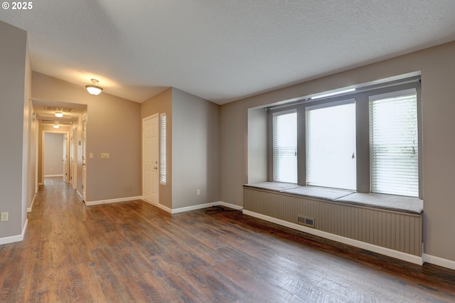 640 Sherman Dr, The Dalles, OR 97058 - unfurnished room with wood finished floors, plenty of natural light, baseboards, and lofted ceiling