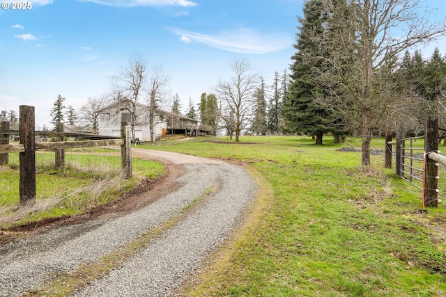 view of road with gravel driveway