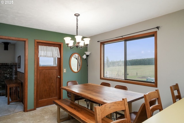 dining space featuring a chandelier