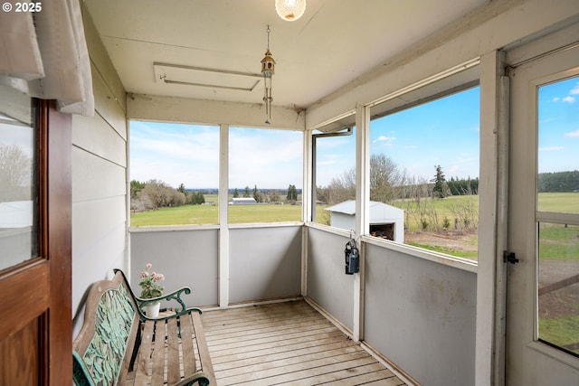 sunroom / solarium featuring a healthy amount of sunlight