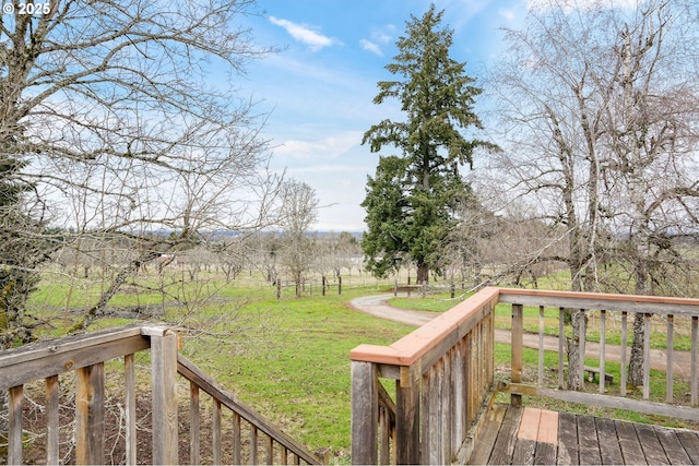 wooden deck featuring a yard