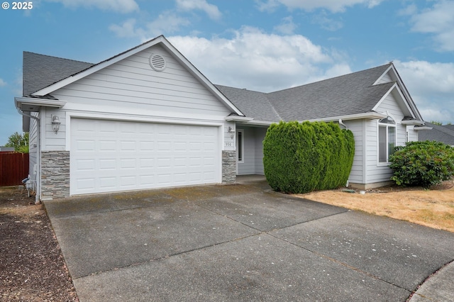 967 Whippoorwill Ct NW, Salem, OR 97304 - ranch-style home with driveway, a shingled roof, stone siding, and an attached garage