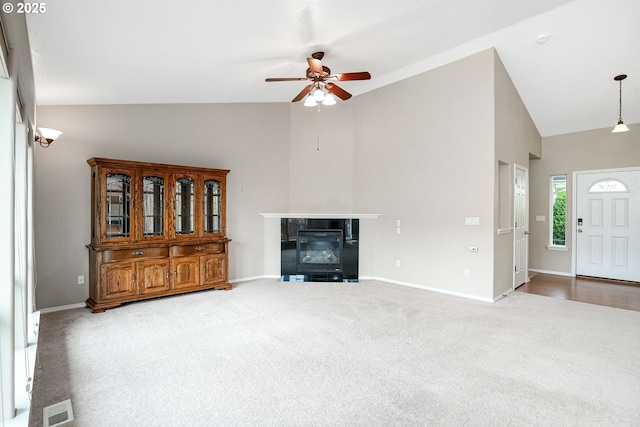 967 Whippoorwill Ct NW, Salem, OR 97304 - living room with ceiling fan, carpet, high vaulted ceiling, and a fireplace with flush hearth