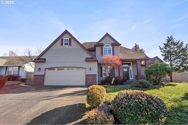 view of front of home featuring a garage and a front yard