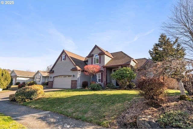 view of property featuring a garage and a front yard