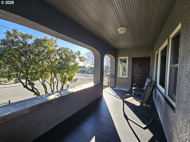 dining space with dark hardwood / wood-style flooring, ceiling fan, and a textured ceiling