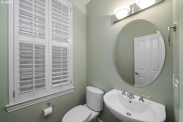 bathroom with sink and toilet