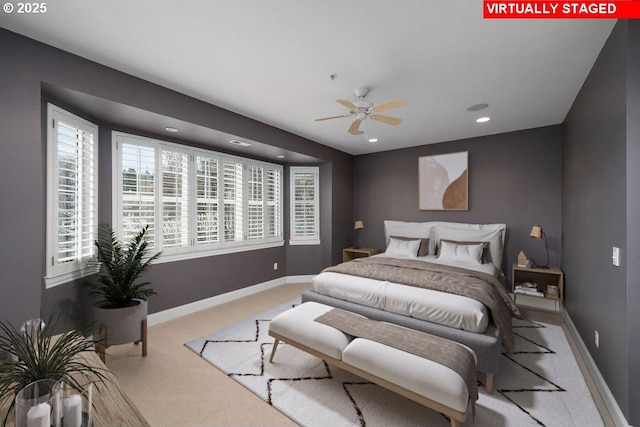 bedroom featuring ceiling fan and light colored carpet