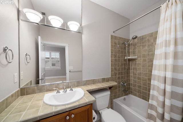 full bathroom with vanity, shower / bath combo, and toilet