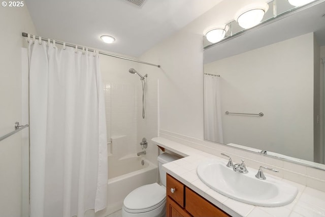 full bathroom with vanity, toilet, and shower / tub combo