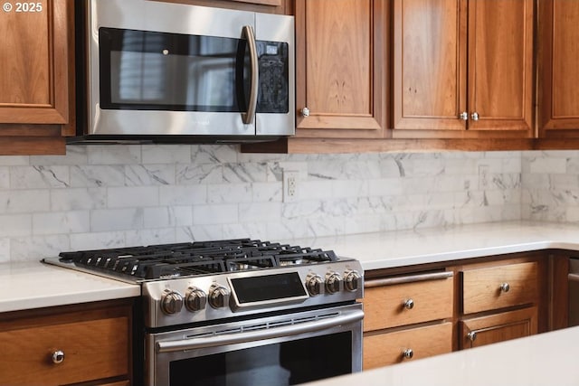 kitchen featuring tasteful backsplash and appliances with stainless steel finishes