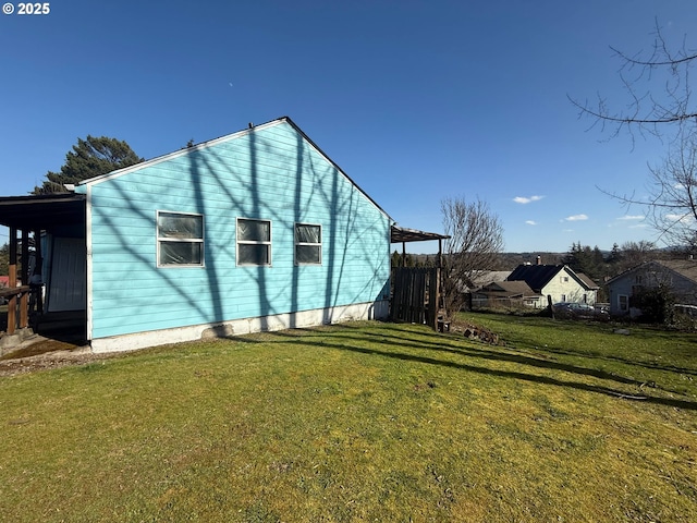 view of property exterior with a lawn