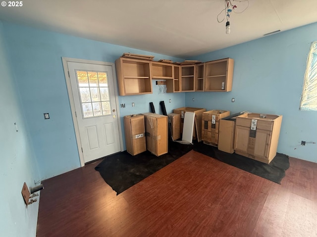 kitchen featuring dark wood finished floors and open shelves