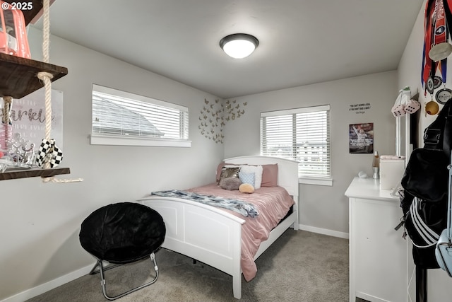 bedroom with carpet floors and baseboards