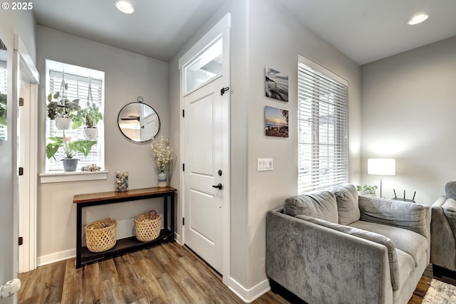 entrance foyer with wood finished floors, baseboards, and recessed lighting