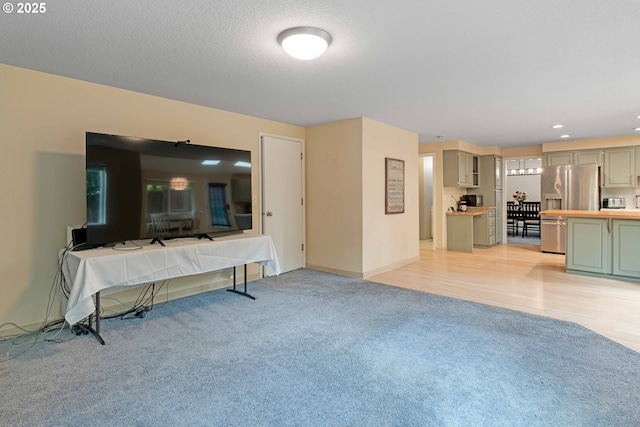 13465 SW Lancewood St, Beaverton, OR 97008 - living room with light carpet, recessed lighting, and baseboards