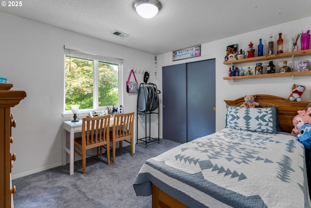 13465 SW Lancewood St, Beaverton, OR 97008 - carpeted bedroom featuring a closet and a textured ceiling